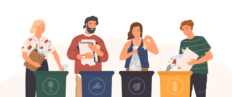 Four people sort different types of recyclable waste into four separate bins.
