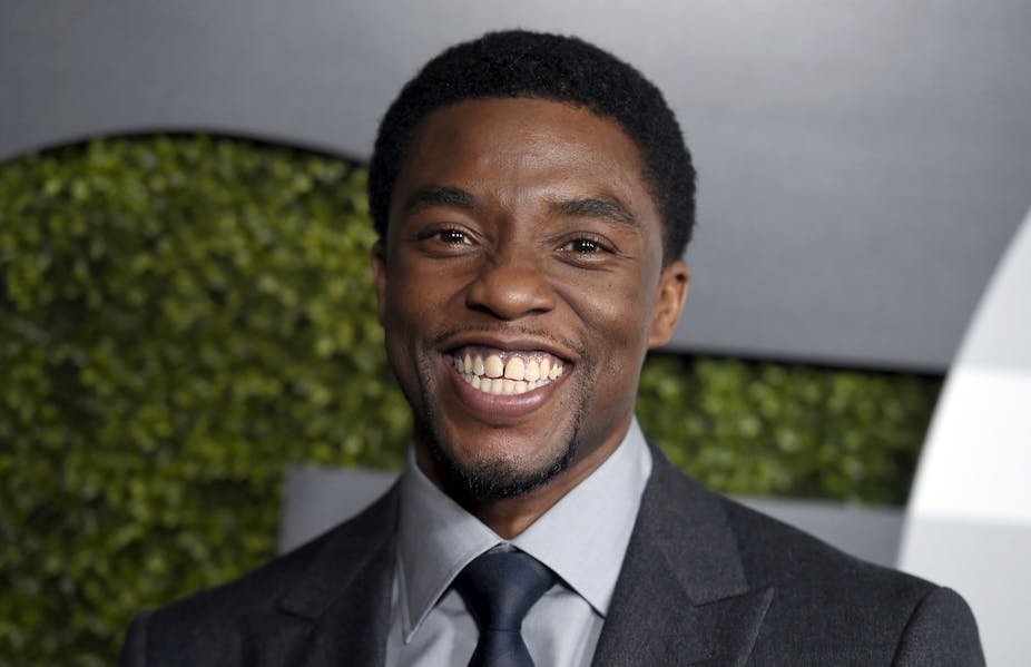 Chadwick Boseman with a big smile on his face in December, 2015