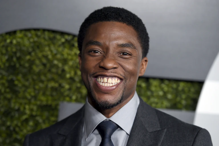 Chadwick Boseman with a big smile on his face in December, 2015