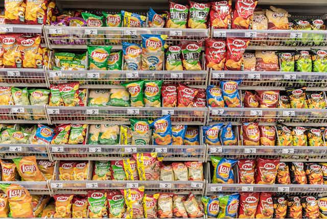 Chip packets in a supermarket aisle