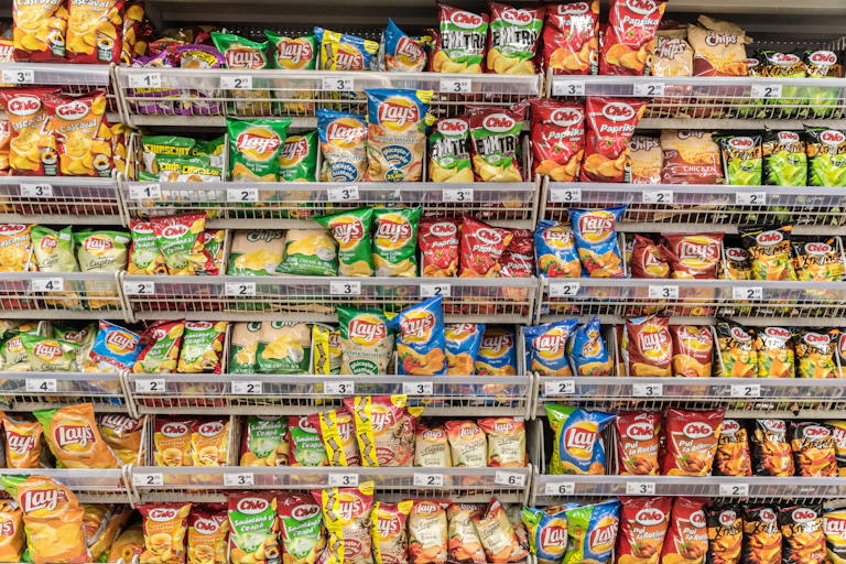 Chip packets in a supermarket aisle