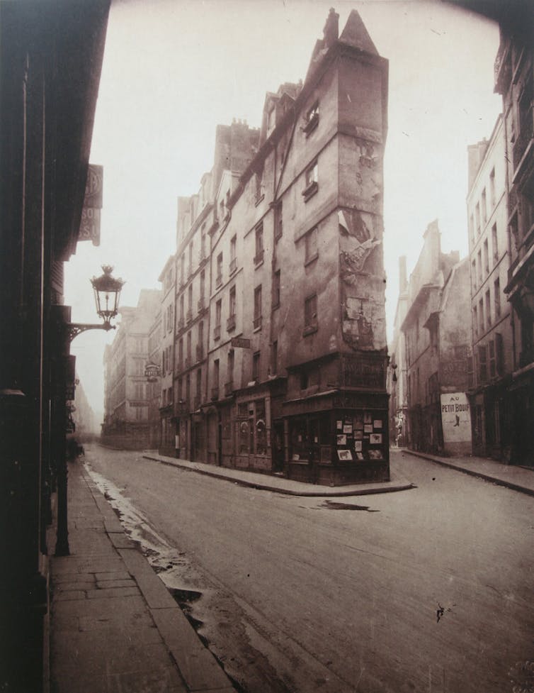 Brown-scale photo of an empty French street.
