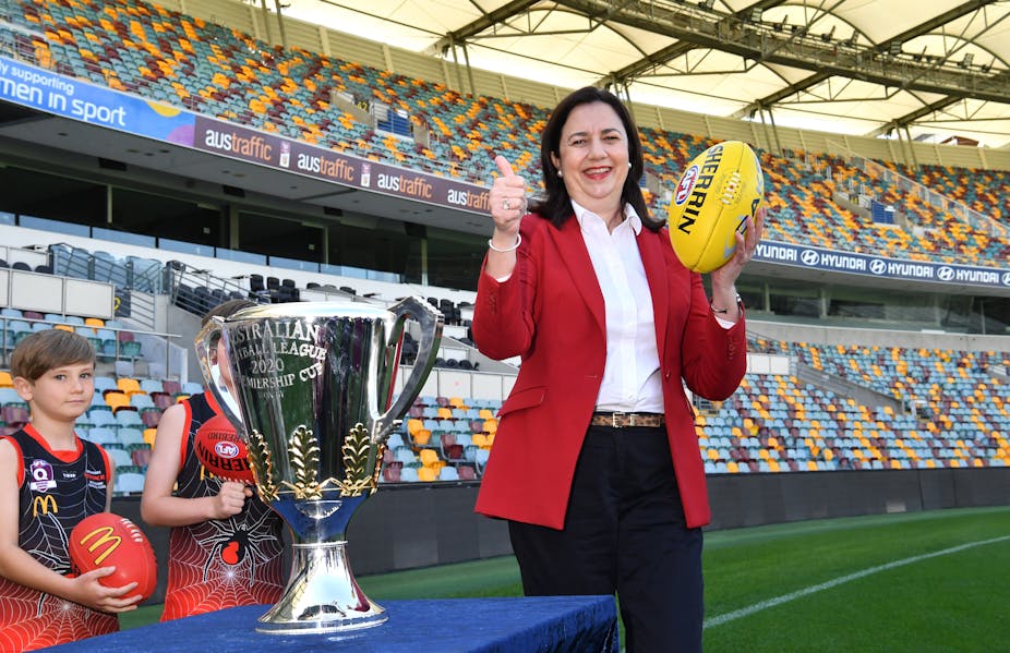 Queensland premier Annastacia Palaszczuk next to the premiership cup