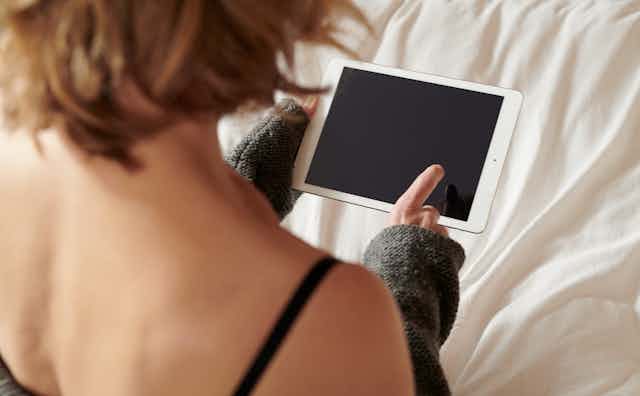 Woman looking at tablet