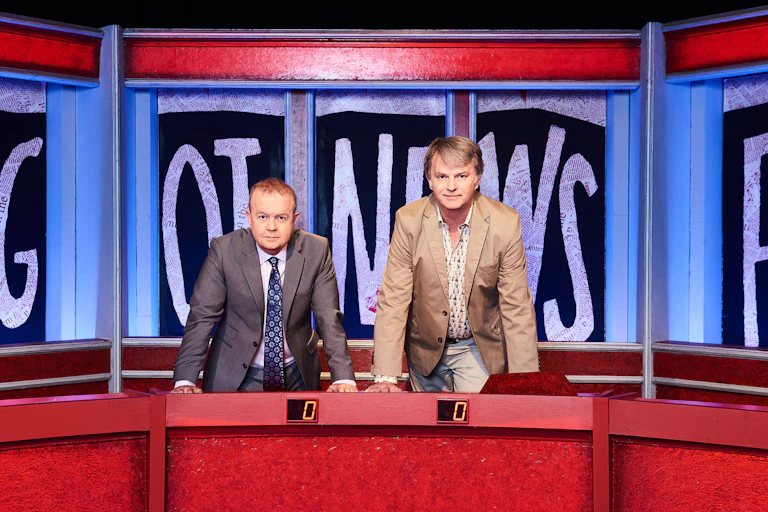 Set of BBC comedy show Have I Got News for You with stars Ian Hislop and Paul Merton in the centre.