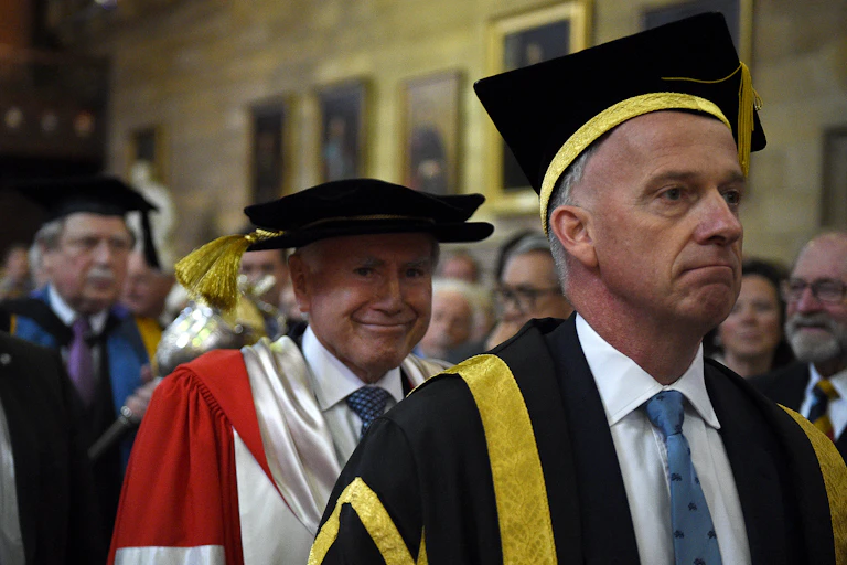 ormer prime minister John Howardwith Vice Chancellor Michael Spence arrives at a ceremony to be presented with an honorary doctorate at the University of Sydney