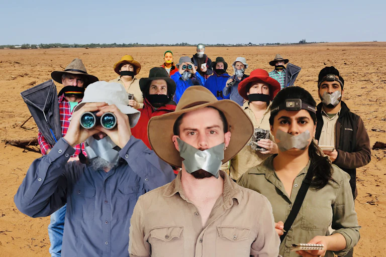 Scientists with their mouths taped shut