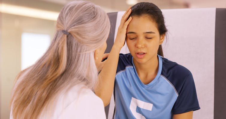 A young person complaining of a headache