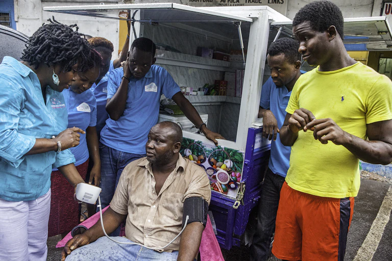 Man getting blood pressure screening