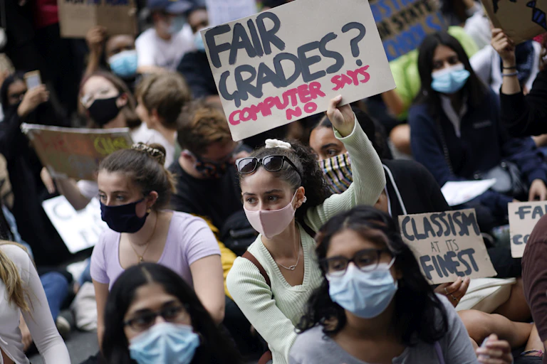 Group of young people holding signs as part of a protest