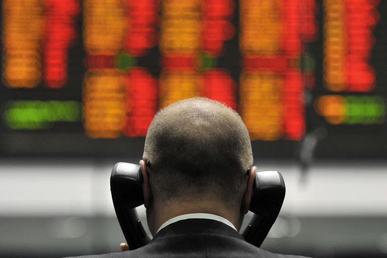 Stock market trader manning the phones