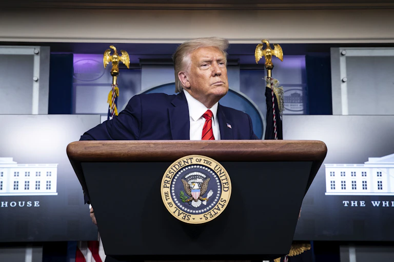 Donald Trump in front of White House lectern.