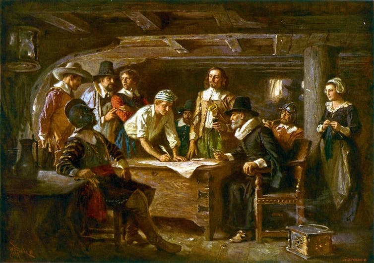 The signatories of the Mayflower Compact aboard the Mayflower.