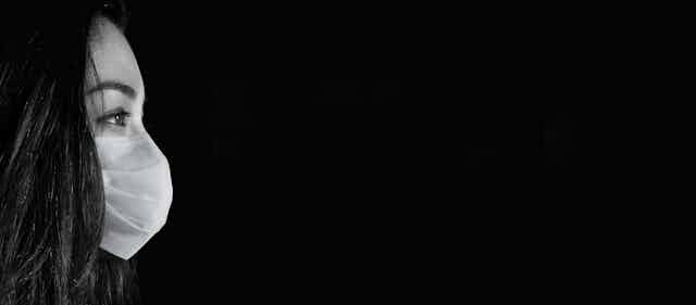 Woman wearing face mask.