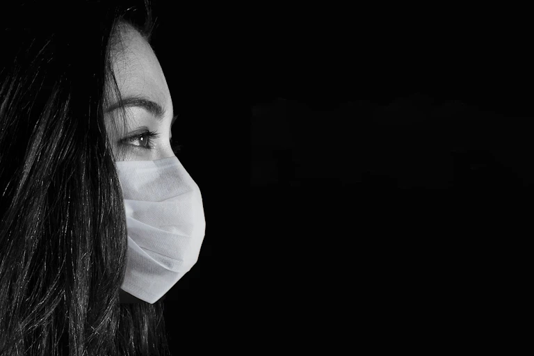Woman wearing face mask.
