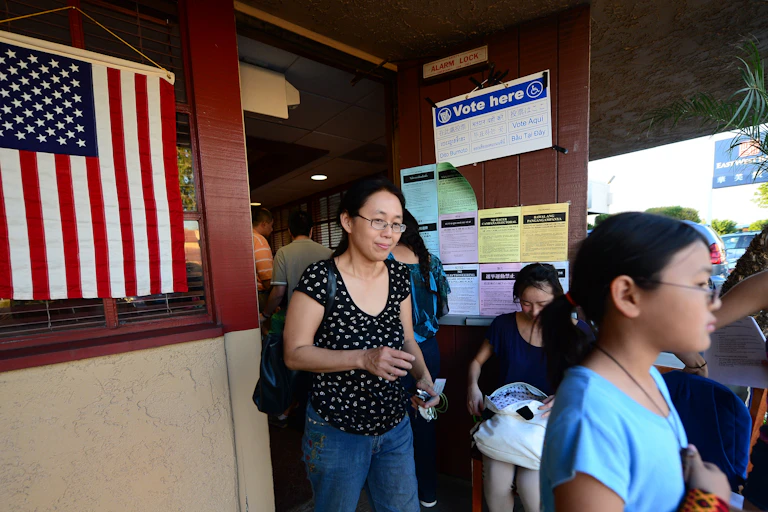 Asian Americans leave a polling palce