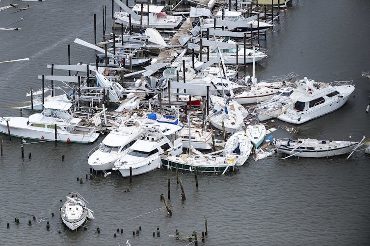 Dozens of boats scattered and sunk in a marina in the aftermath of Hurricane Harvey.