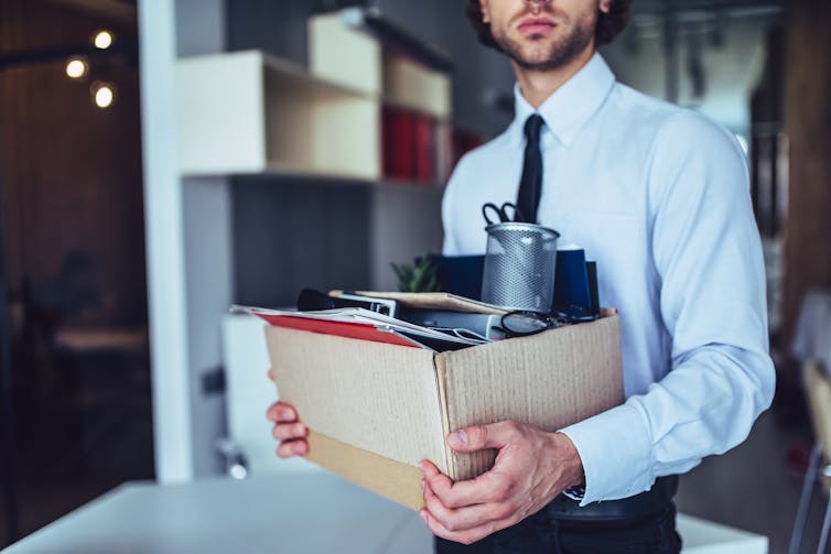 Man carrying box of office supplies