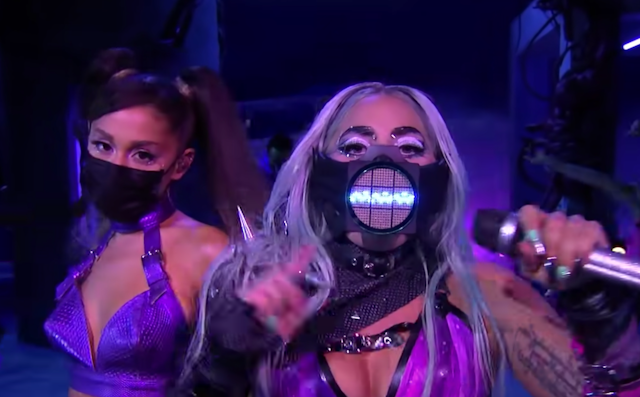 Lady Gaga in a facemask with a sound wave and Arianna Grande in a black face mask.