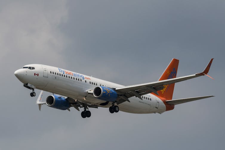 A Sunwing passenger plane prepares to land.