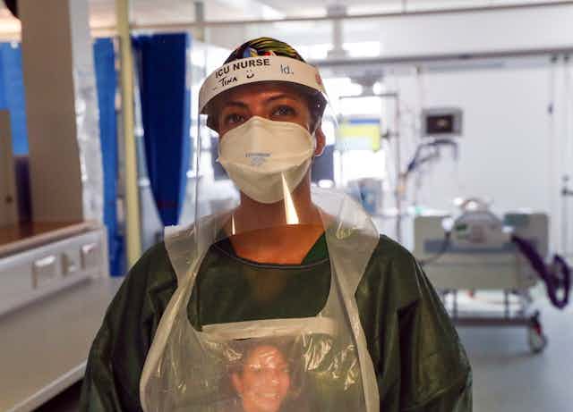 A nurse wears PPE at a hospital