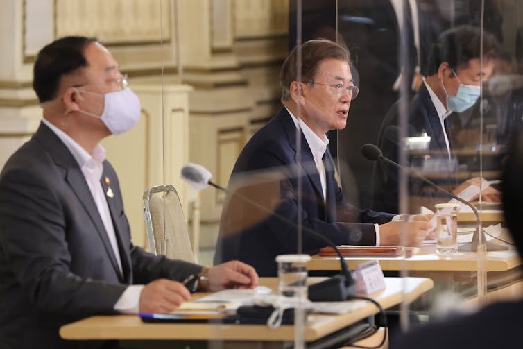 South Korean President Moon Jae-in, centre, discussing the K-New Deal