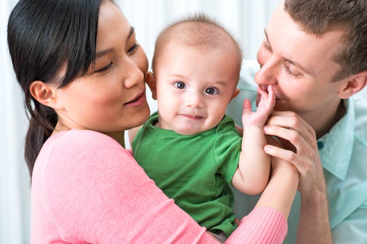 A mum, dad and a baby.