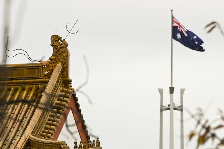 The Chinese embassy, with the Australian flag in the background