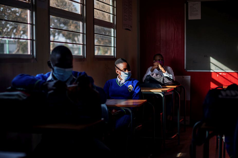 Pupils wearing masks in a classroom.