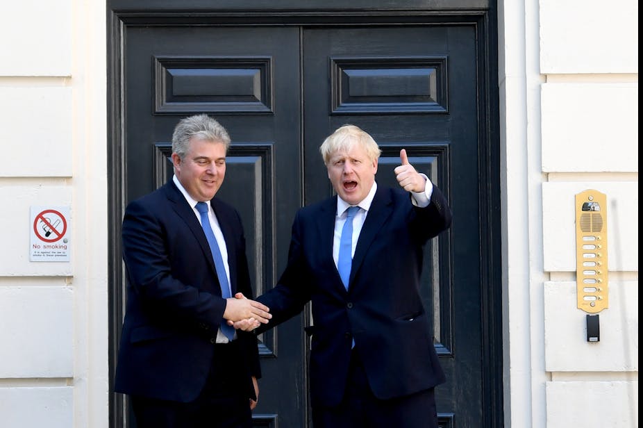 Brandon Lewis and Boris Johnson shaking hands.