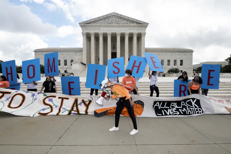 YOung people rallying in front of the Supreme Court.