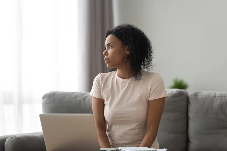 Woman at home looking distressed