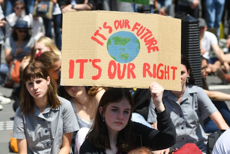 A climate protest, with a sign that says 'it's out future, it's our right'.