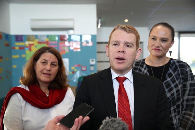 Man and two women in a classroom