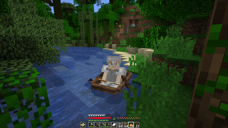 A minecraft character on a screen rowing a boat, surrounded by greenery