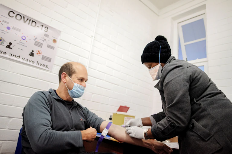 A man receiving an injection