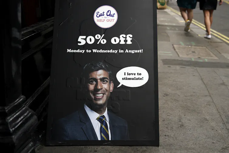 Billboard advertising Eat Out to Help Out with picture of Chancellor Rishi Sunak