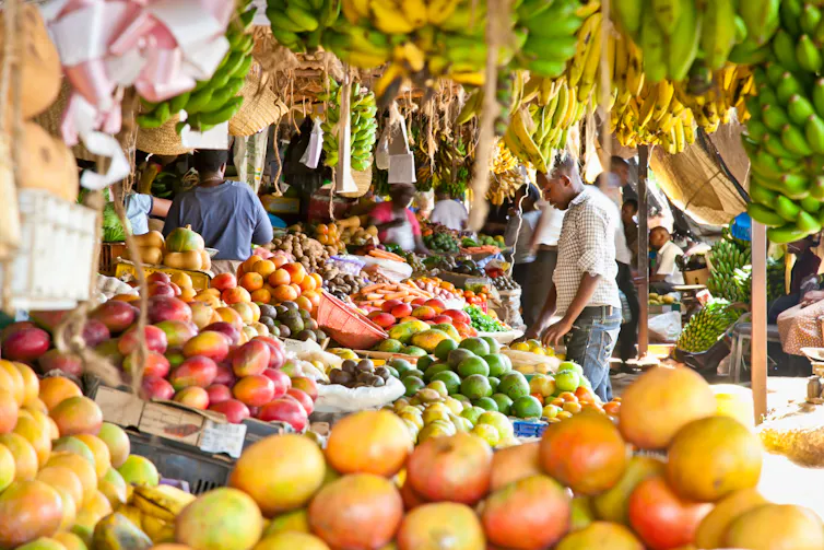 Ripe fruits stacked at a local fruit and vegetable market.