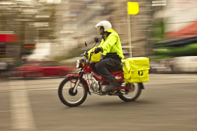 Postie on a motorbike