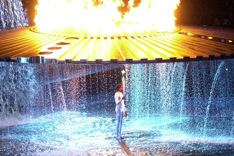 Cathy Freeman under the Sydney Olympic cauldron