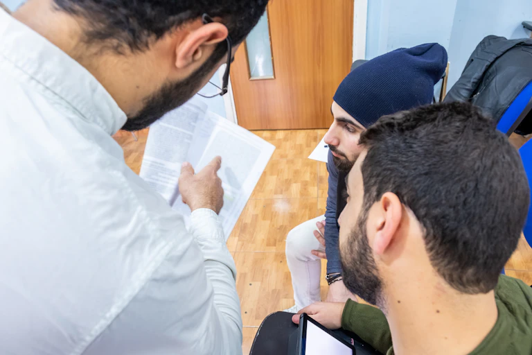 Academic discusses work with two students