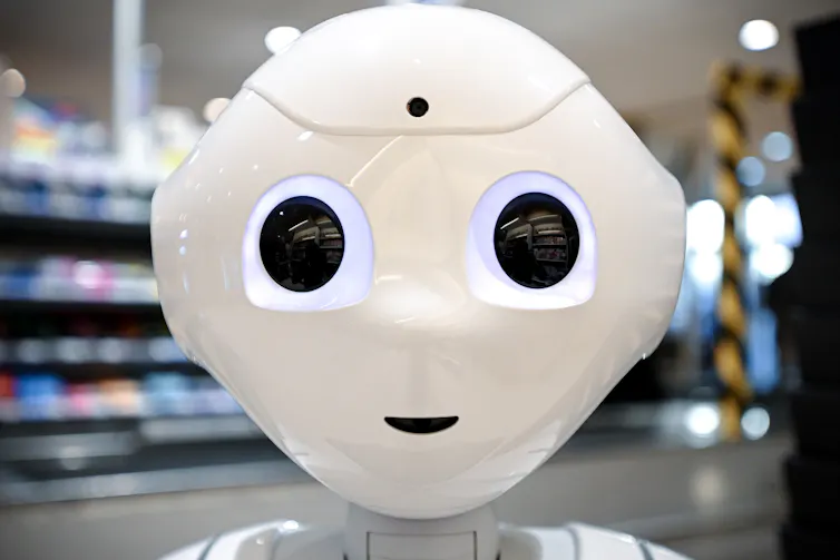 Close-up of a white robot face.