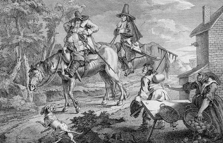 Two men on horses surprise two other people and overturn table. Dog barking in foreground.