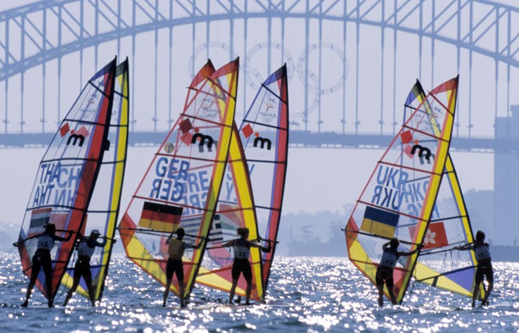 Sail boats in front of the Sydney Harbour Bridge.