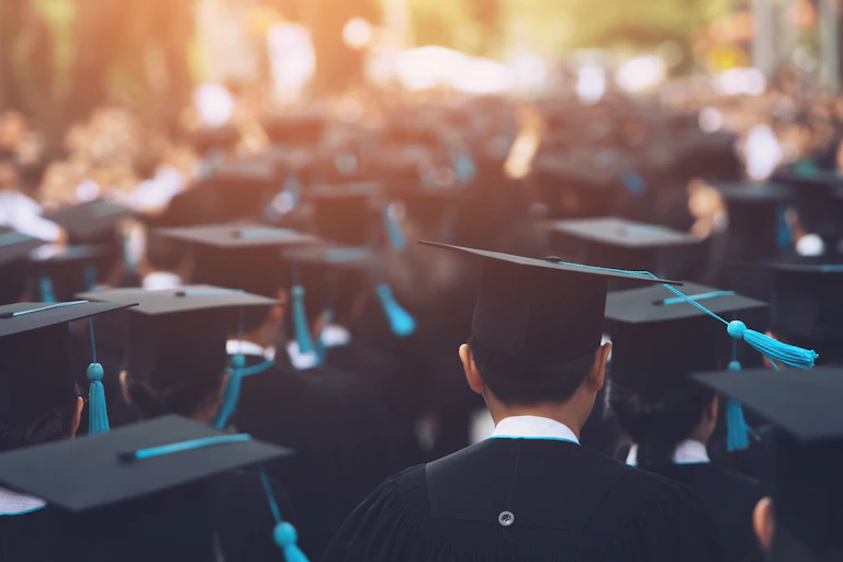 University graduates in their academic gear on graduation day.