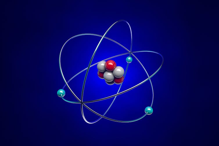 A simplified illustration of an atom showing protons, nucleons and electrons