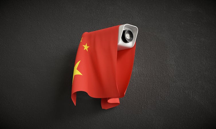 Illustration of surveillance camera with Chinese flag draped over.