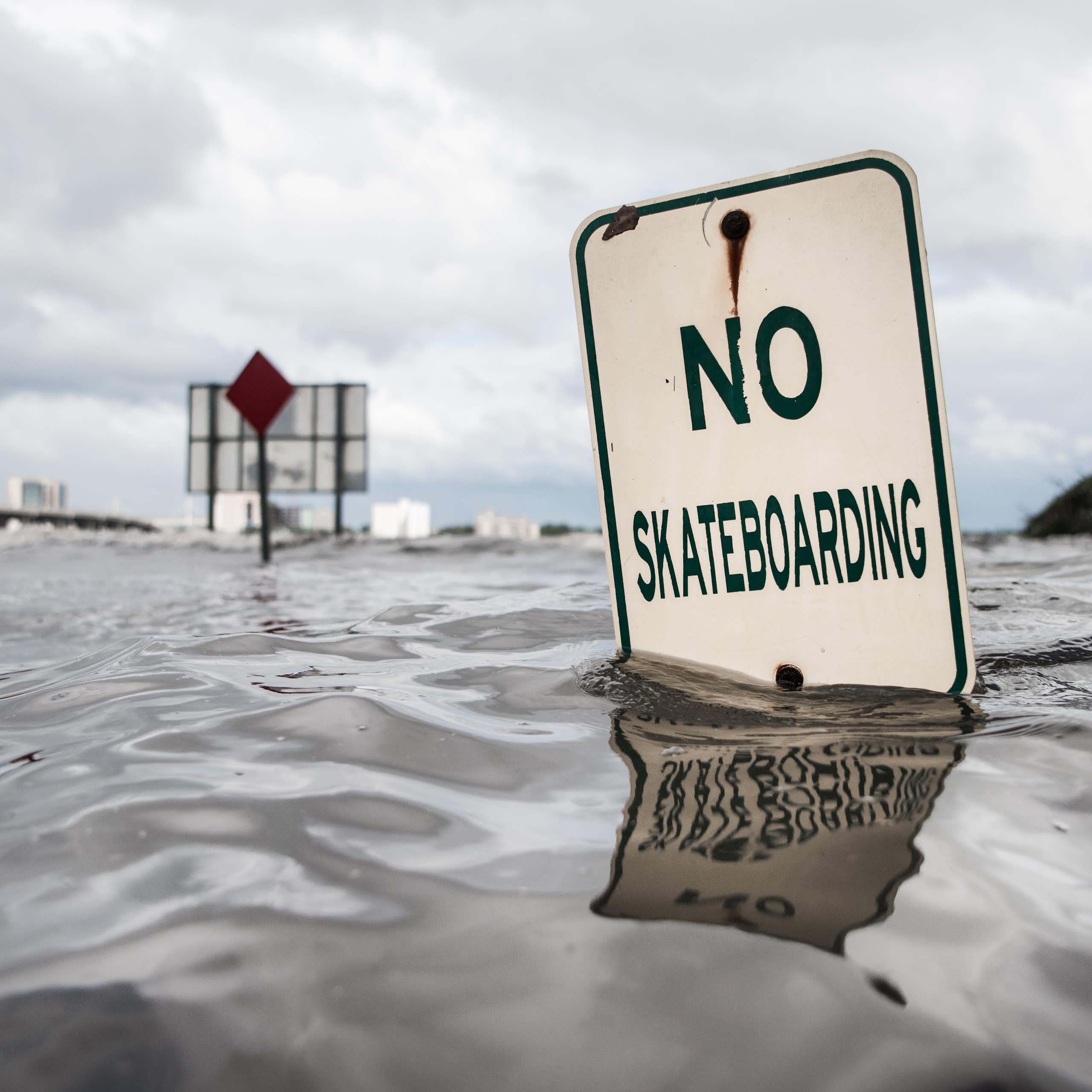 A 'no skateboarding' sign under water along the St. Johns River in Jacksonville, Florida, during Hurricane Irma.