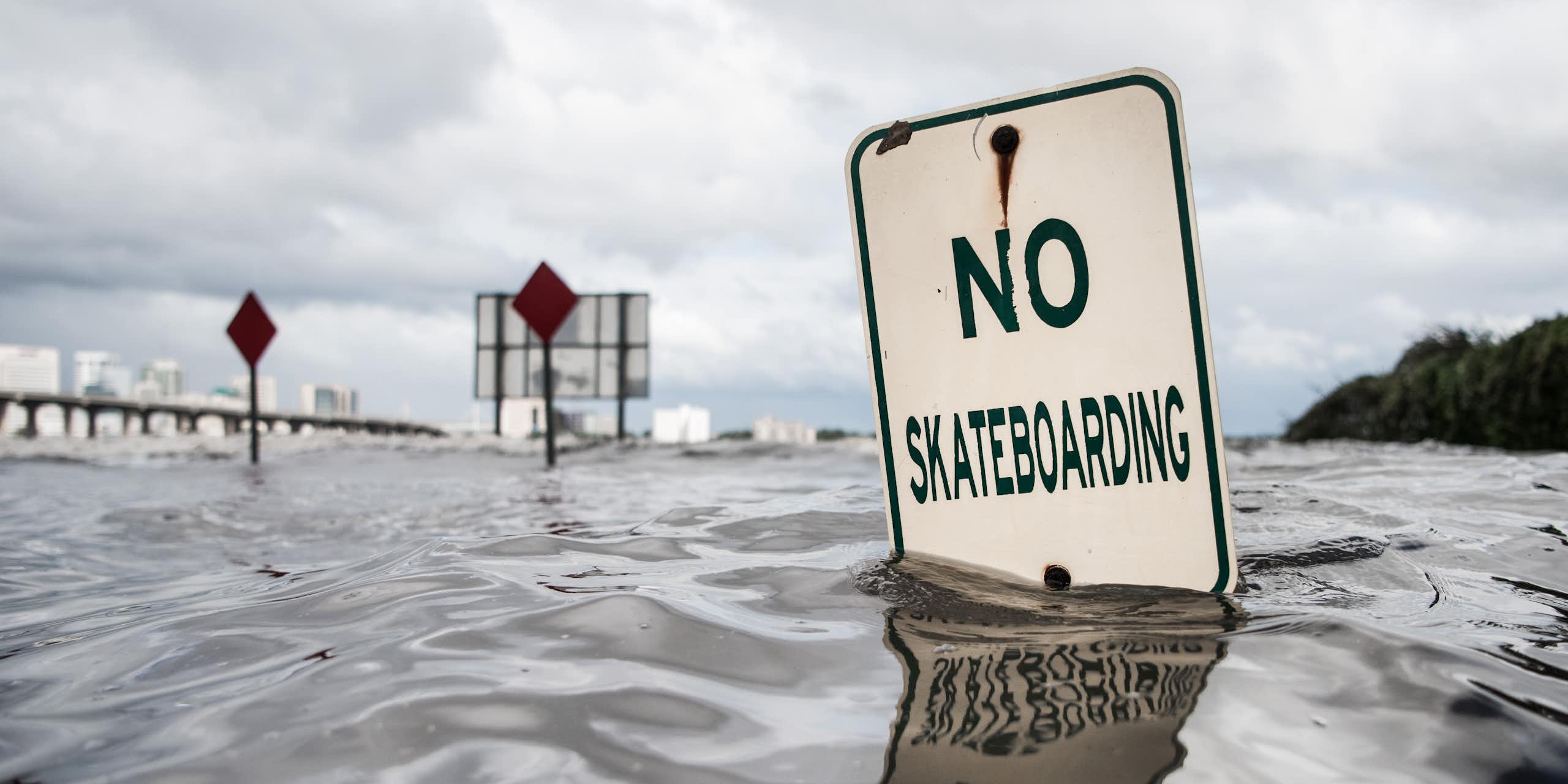 A 'no skateboarding' sign under water along the St. Johns River in Jacksonville, Florida, during Hurricane Irma.