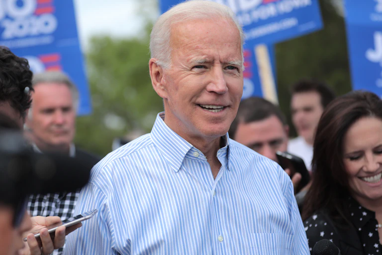 Democratic presidential nominee Joe Biden with a group of people outdoors
